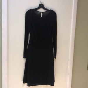 a black knee length cocktail dress.